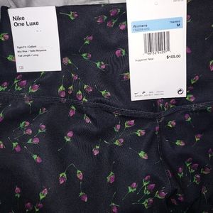 Nike size Medium black leggings with flower design